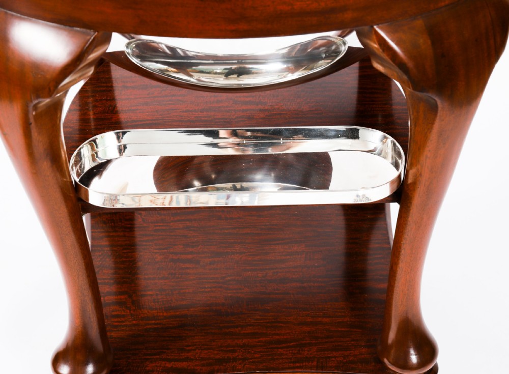 An Art Deco silver-plated beef carving trolley with a hemispherical revolving dome cover mounted on a dark mahogany frame with cabriole legs. View XV