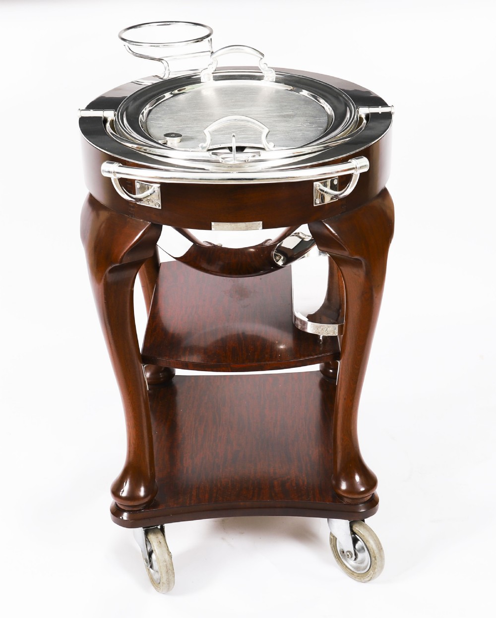 An Art Deco silver-plated beef carving trolley with a hemispherical revolving dome cover mounted on a dark mahogany frame with cabriole legs. View XVII
