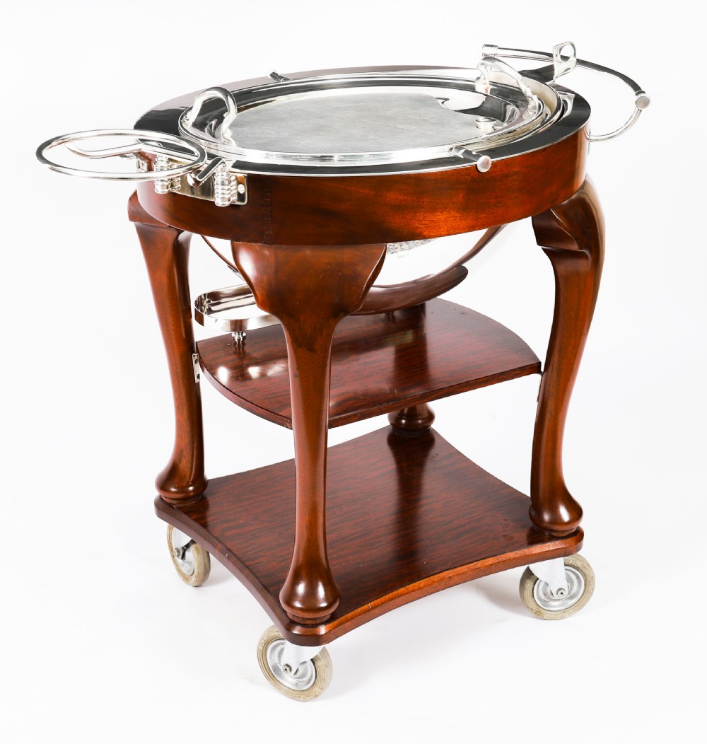 An Art Deco silver-plated beef carving trolley with a hemispherical revolving dome cover mounted on a dark mahogany frame with cabriole legs. View XVIII