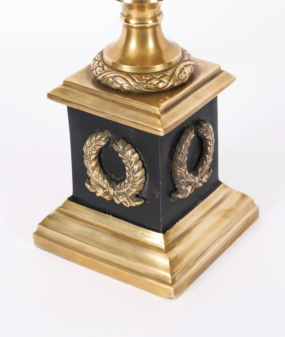 A pair of 19th-century Neoclassical brass Grand Tour campana urns mounted on square black plinths with gilded laurel wreath embellishments. View VI