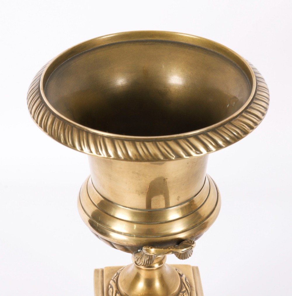A pair of 19th-century Neoclassical brass Grand Tour campana urns mounted on square black plinths with gilded laurel wreath embellishments. View XI