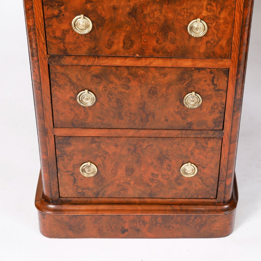 A nineteenth-century Victorian burr walnut twin pedestal desk featuring a green leather writing insert, brass ring handles, and multiple drawers. View VII