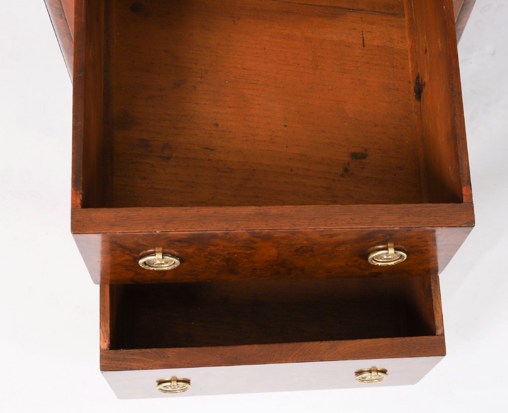 A nineteenth-century Victorian burr walnut twin pedestal desk featuring a green leather writing insert, brass ring handles, and multiple drawers. View XII