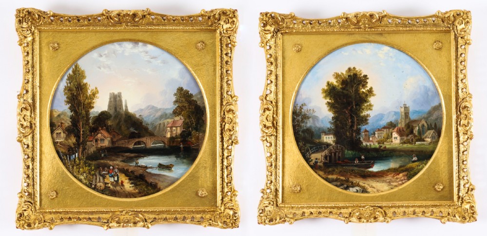 A pair of nineteenth-century oil paintings on board depicting river scenes with figures and ruins, housed in square gilded frames with circular tondo apertures. View II