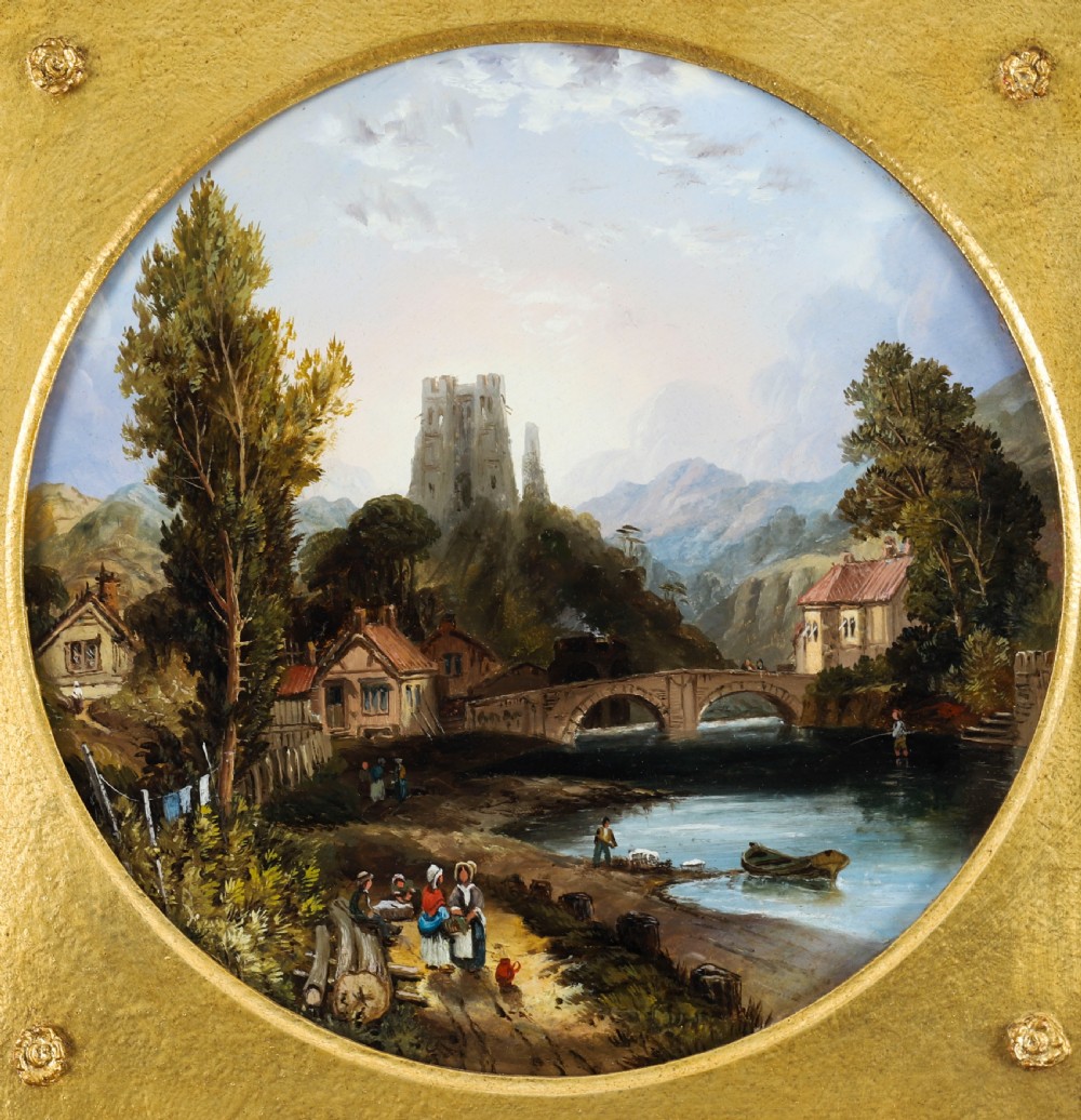 A pair of nineteenth-century oil paintings on board depicting river scenes with figures and ruins, housed in square gilded frames with circular tondo apertures. View XI