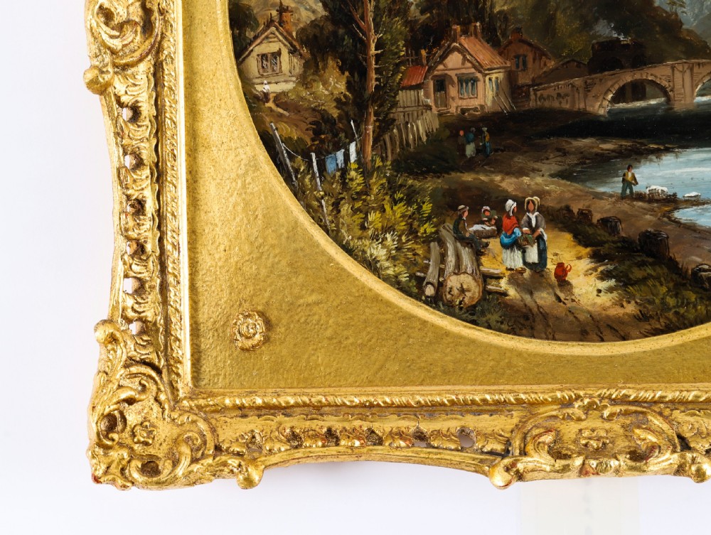 A pair of nineteenth-century oil paintings on board depicting river scenes with figures and ruins, housed in square gilded frames with circular tondo apertures. View XII