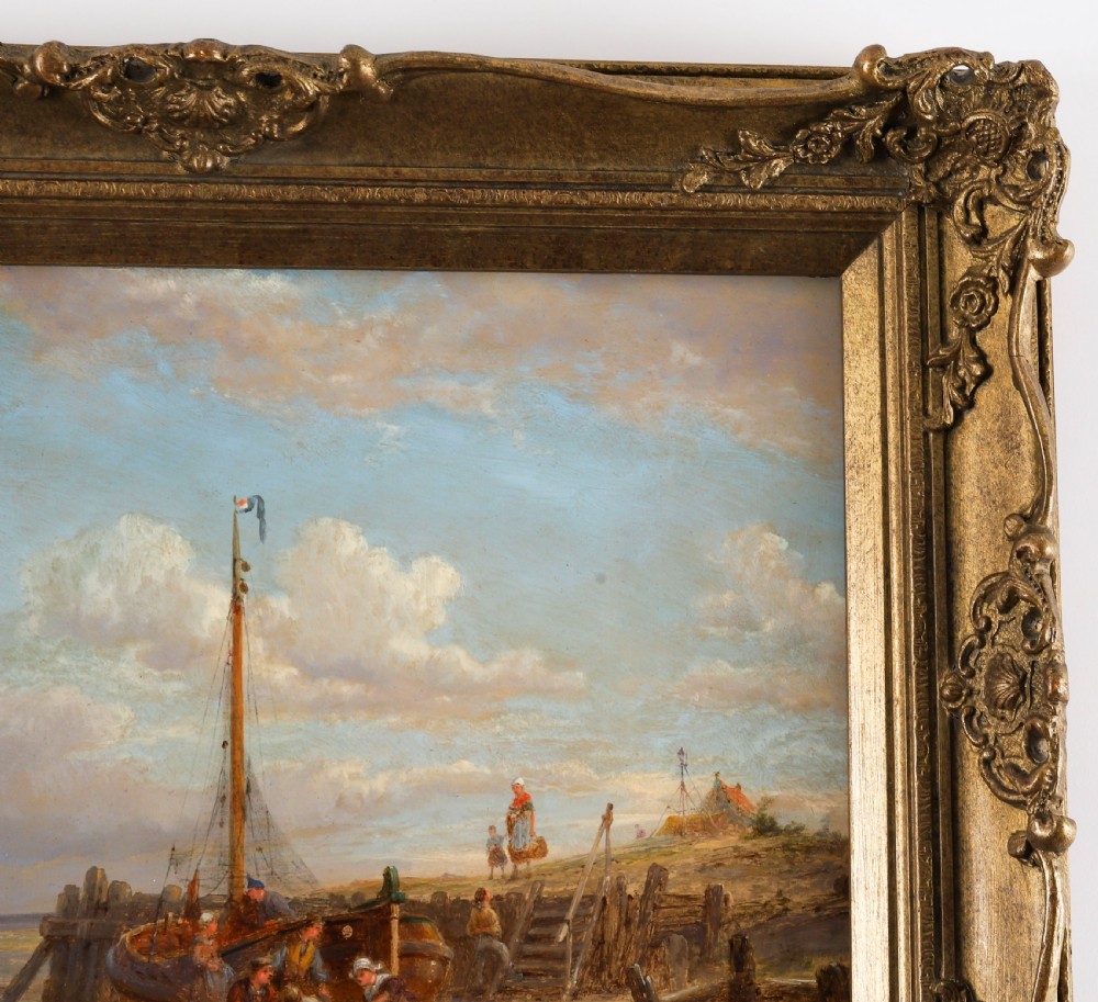 A pair of early 20th-century Dutch maritime oil paintings depicting fishing vessels and figures on a beach, framed in ornate giltwood frames. View VII