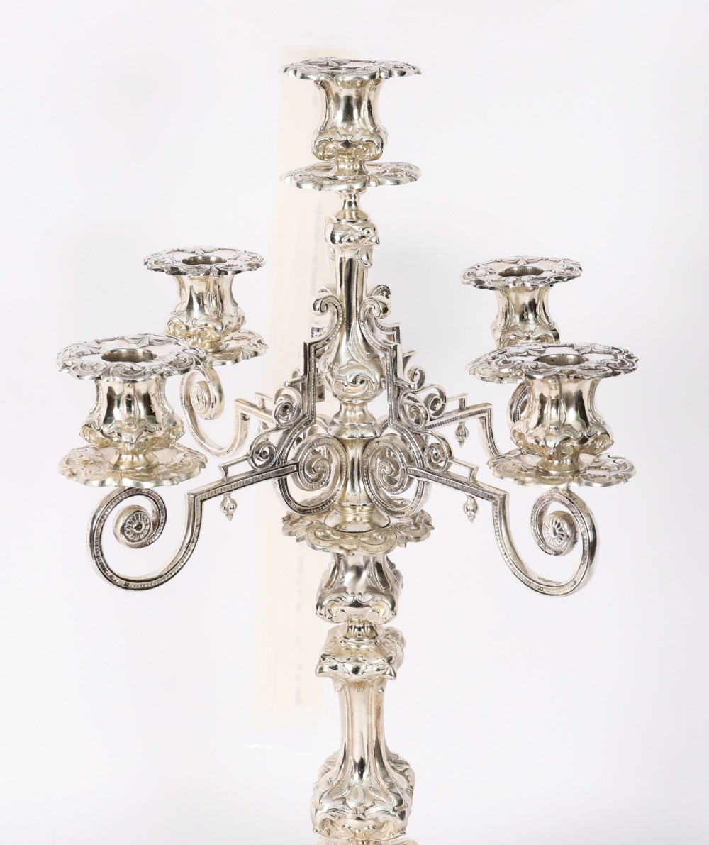 An ornate 19th-century Swedish five-light silver-plated candelabra featuring elaborate scrolling arms and a decorated shaped base. View V