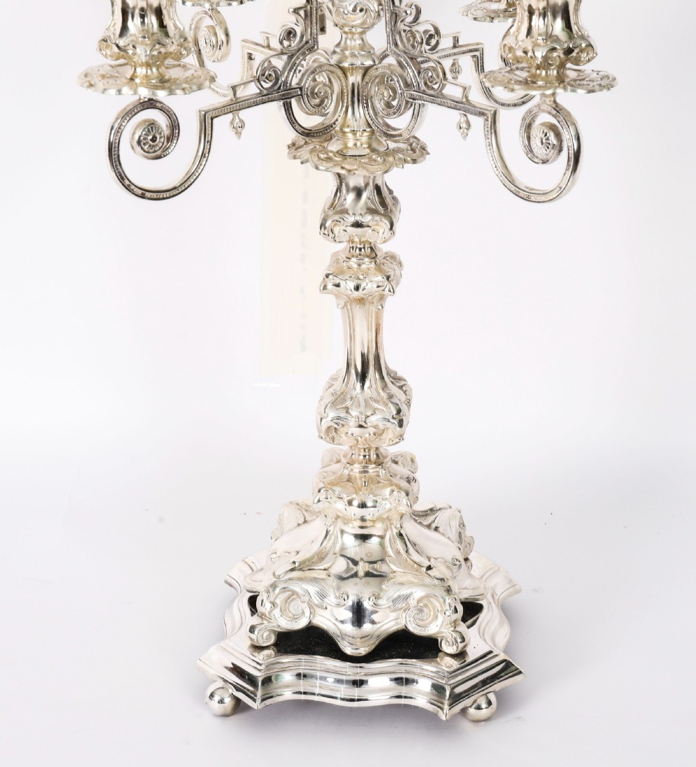 An ornate 19th-century Swedish five-light silver-plated candelabra featuring elaborate scrolling arms and a decorated shaped base. View VII