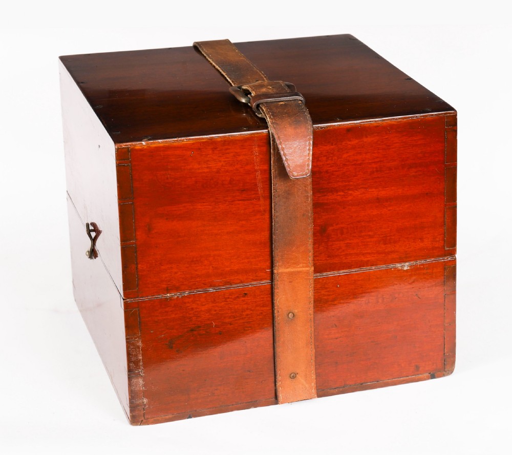 An open mahogany transit box displaying a 19th-century Paget star celestial globe with calibrated brass rings set over green felt lining. View V
