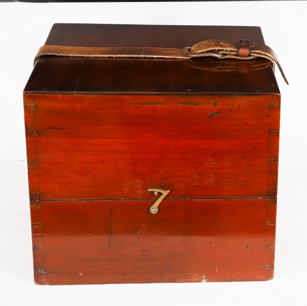 An open mahogany transit box displaying a 19th-century Paget star celestial globe with calibrated brass rings set over green felt lining. View XII