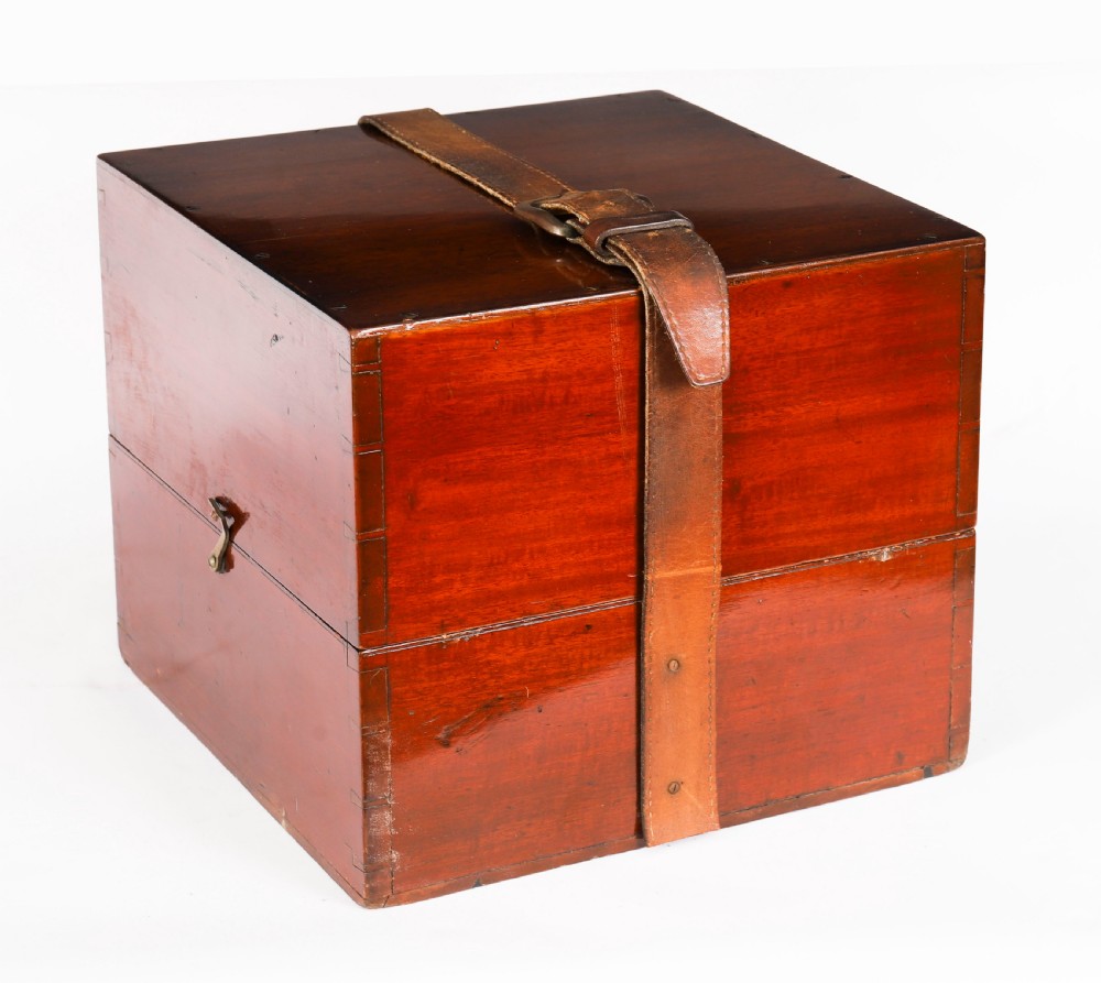 An open mahogany transit box displaying a 19th-century Paget star celestial globe with calibrated brass rings set over green felt lining. View XVI