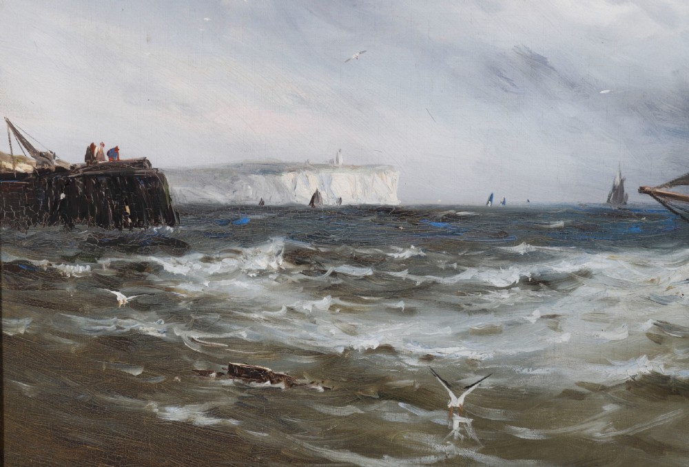 A pair of framed 19th-century oil on canvas paintings depicting coastal seascapes with wooden fishing vessels, encased in dark wood frames with gilded inner slips. View V
