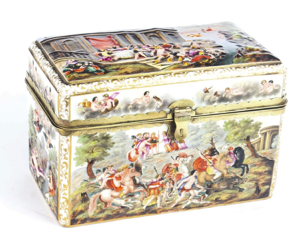 A rectangular 19th-century Capodimonte porcelain casket featuring relief-moulded classical figures, gilt brass mounts, and a hinged lid.