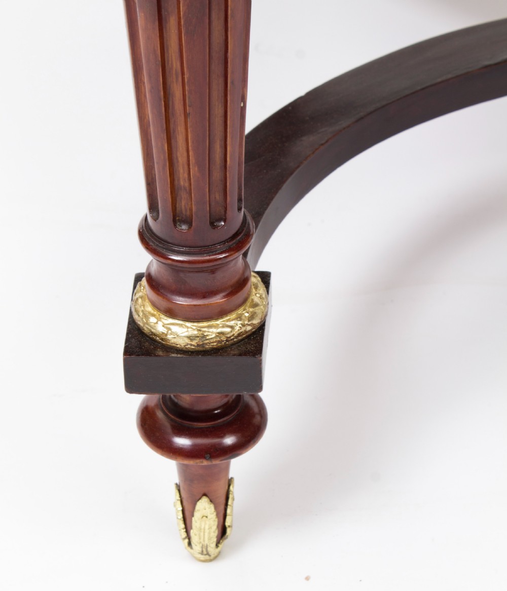 An antique French bureau plat writing table featuring detailed floral marquetry inlays, decorative gilt-bronze ormolu mounts, turned legs, and an X-frame stretcher. View XIII