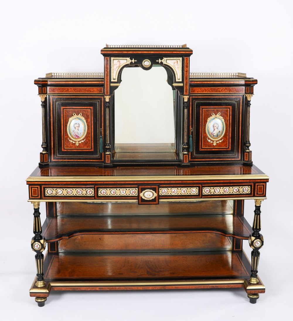 Victorian amboyna and ebonised bonheur du jour desk with porcelain portrait plaques, brass mounts, a central mirror, and an open lower shelf. View III
