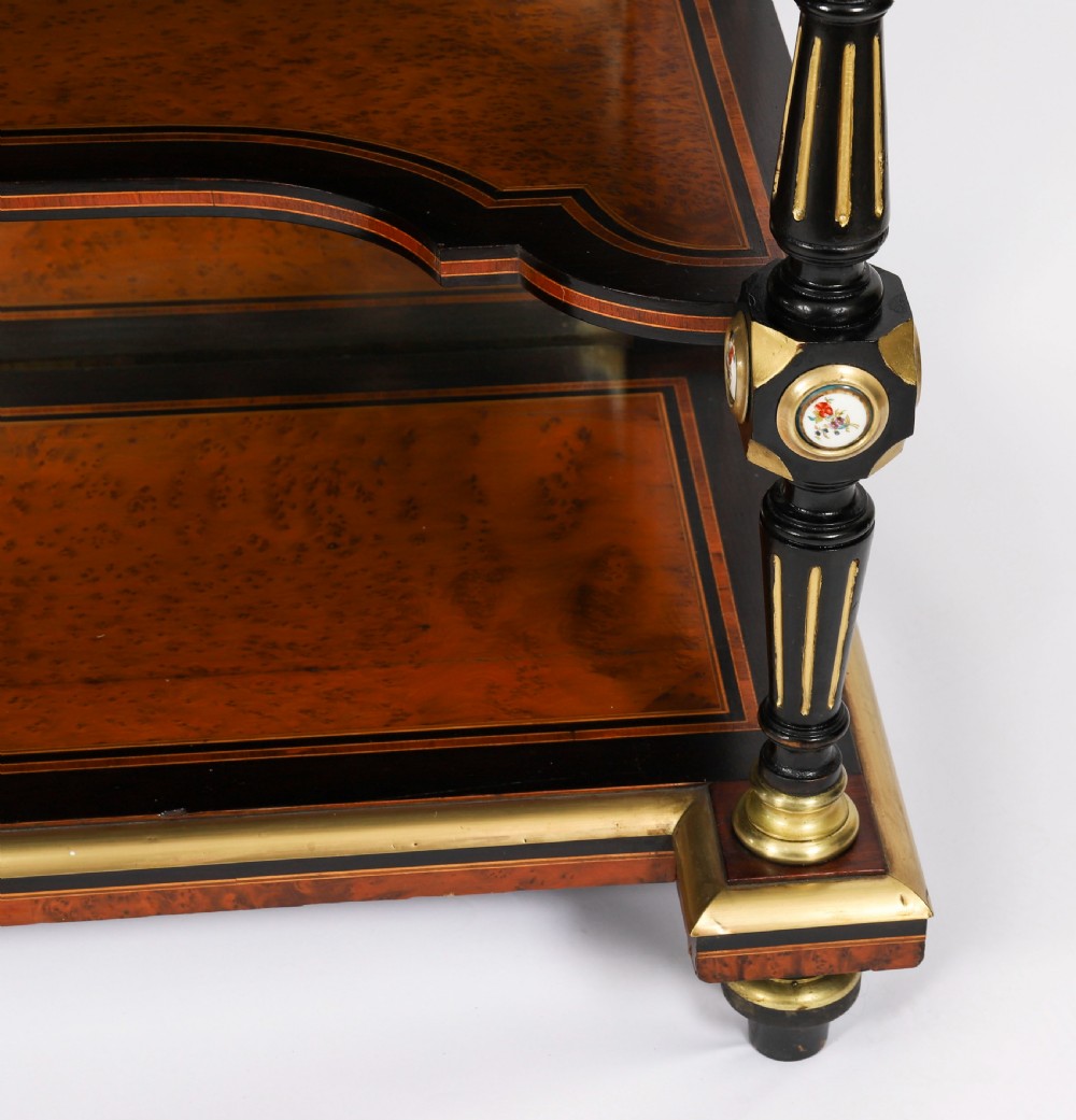 Victorian amboyna and ebonised bonheur du jour desk with porcelain portrait plaques, brass mounts, a central mirror, and an open lower shelf. View X