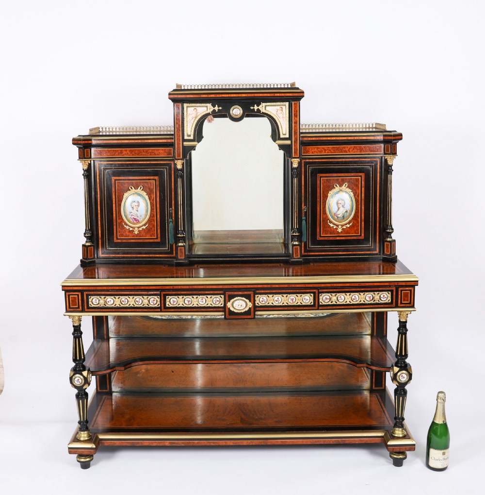 Victorian amboyna and ebonised bonheur du jour desk with porcelain portrait plaques, brass mounts, a central mirror, and an open lower shelf. View XVIII