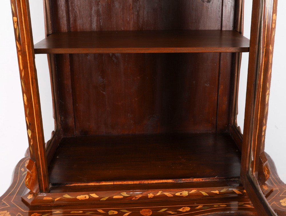 An 18th-century Dutch walnut cabinet on chest featuring detailed floral marquetry inlay, an arched bonnet top with glass doors, and four brass-handled drawers. View VII