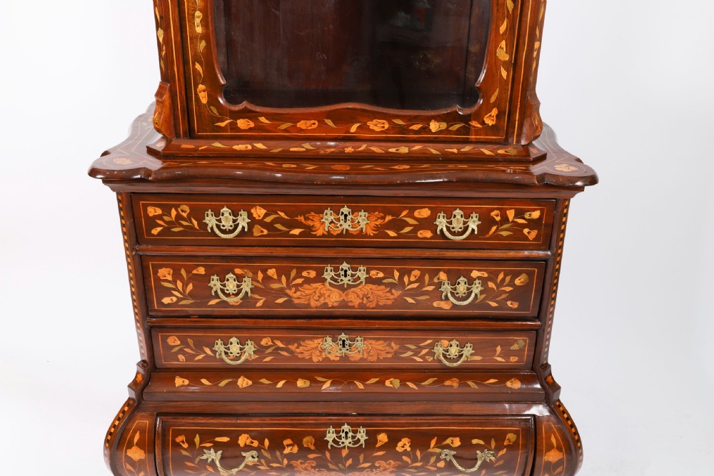 An 18th-century Dutch walnut cabinet on chest featuring detailed floral marquetry inlay, an arched bonnet top with glass doors, and four brass-handled drawers. View X