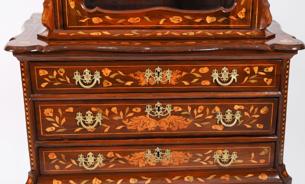 An 18th-century Dutch walnut cabinet on chest featuring detailed floral marquetry inlay, an arched bonnet top with glass doors, and four brass-handled drawers. View XII