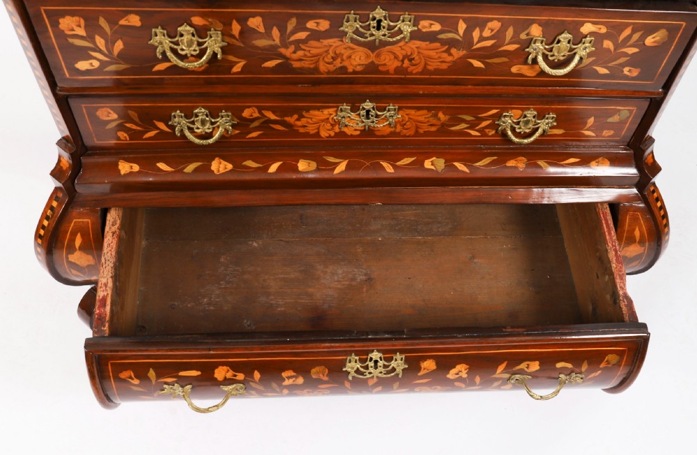 An 18th-century Dutch walnut cabinet on chest featuring detailed floral marquetry inlay, an arched bonnet top with glass doors, and four brass-handled drawers. View XV