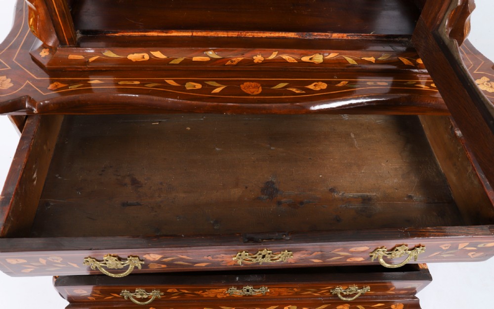 An 18th-century Dutch walnut cabinet on chest featuring detailed floral marquetry inlay, an arched bonnet top with glass doors, and four brass-handled drawers. View XVI