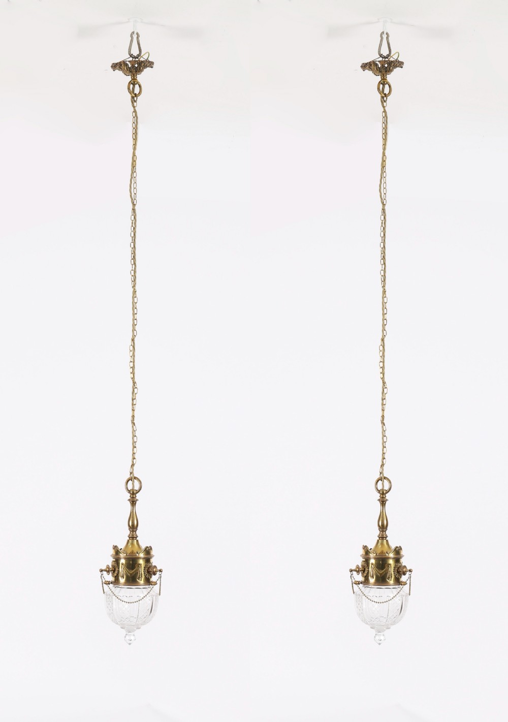 An antique Edwardian brass ceiling pendant light featuring a cast brass collar decorated with swag motifs and a cut crystal shade. View XIV