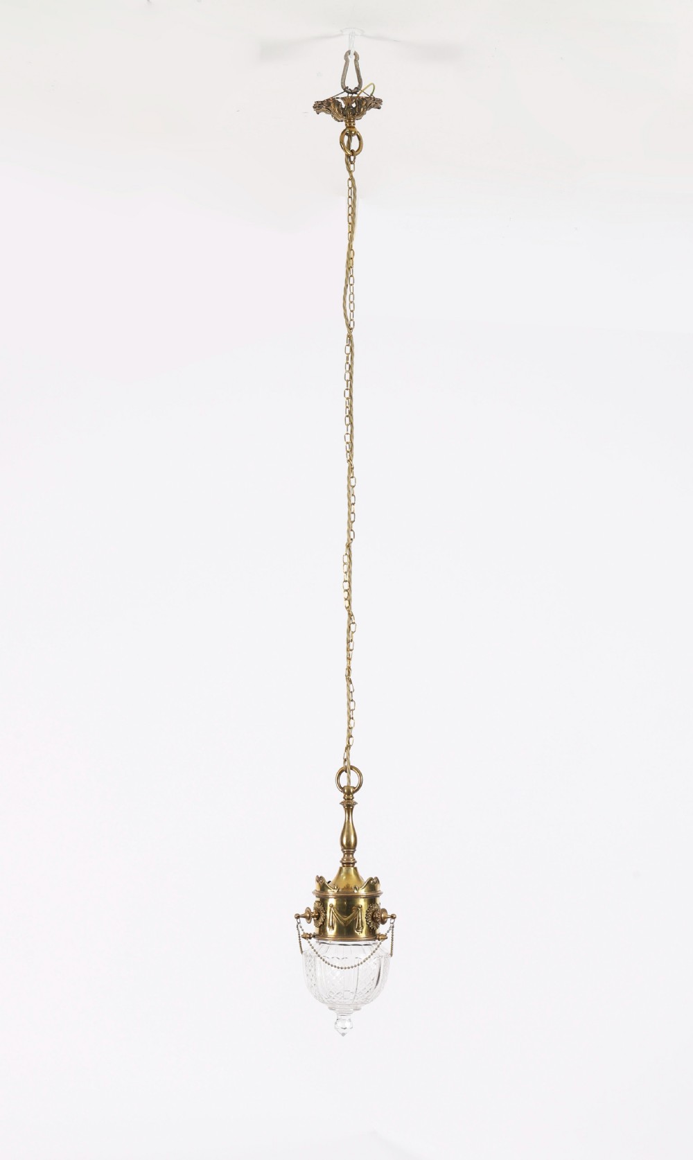An Edwardian ceiling pendant light featuring an ornate brass gallery decorated with swags and rosettes, suspending a cut crystal glass globe with a pointed base finial. View XIII