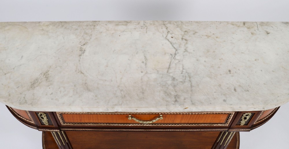 A pair of 19th-century French Louis XVI style demi-lune console tables with white Carrara marble tops, gilt bronze mounts, fluted legs, and undershelves. View III