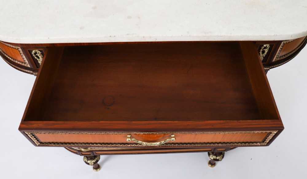 A pair of 19th-century French Louis XVI style demi-lune console tables with white Carrara marble tops, gilt bronze mounts, fluted legs, and undershelves. View XI
