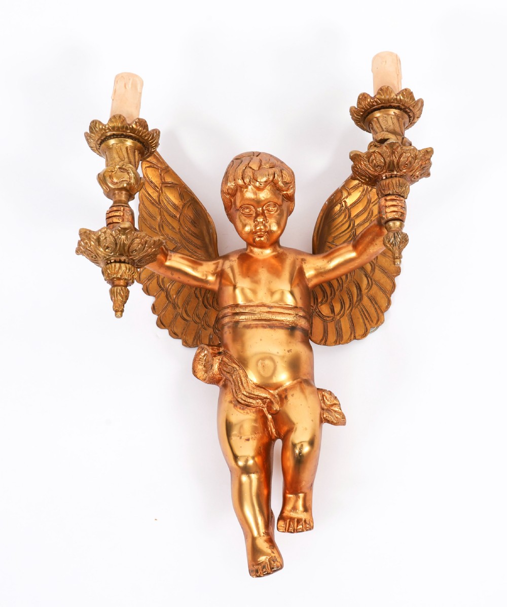 A pair of nineteenth-century gilt metal two-branch wall sconces featuring sculpted winged cherubs holding torch-shaped candleholders. View VII