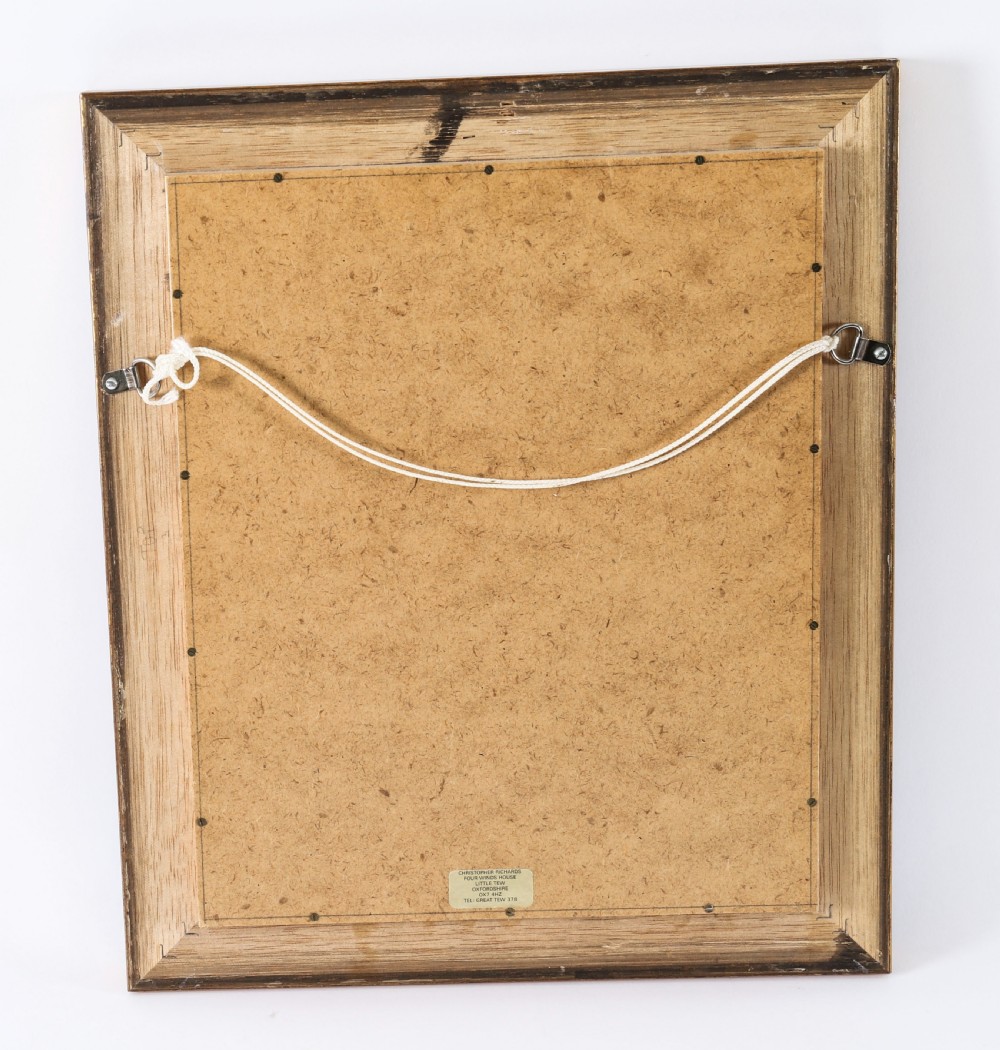 A pair of gold giltwood frames displaying classical white plaster intaglio casts arranged symmetrically against a dark background. View VI