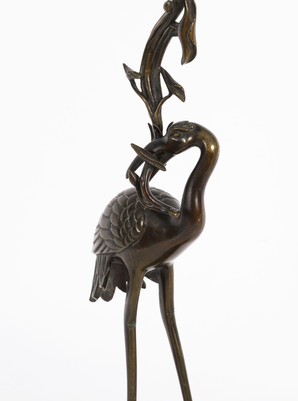 A pair of 19th-century Japanese dark bronze pricket candlesticks formed as cranes standing on tortoises holding lotus stems in their beaks. View III