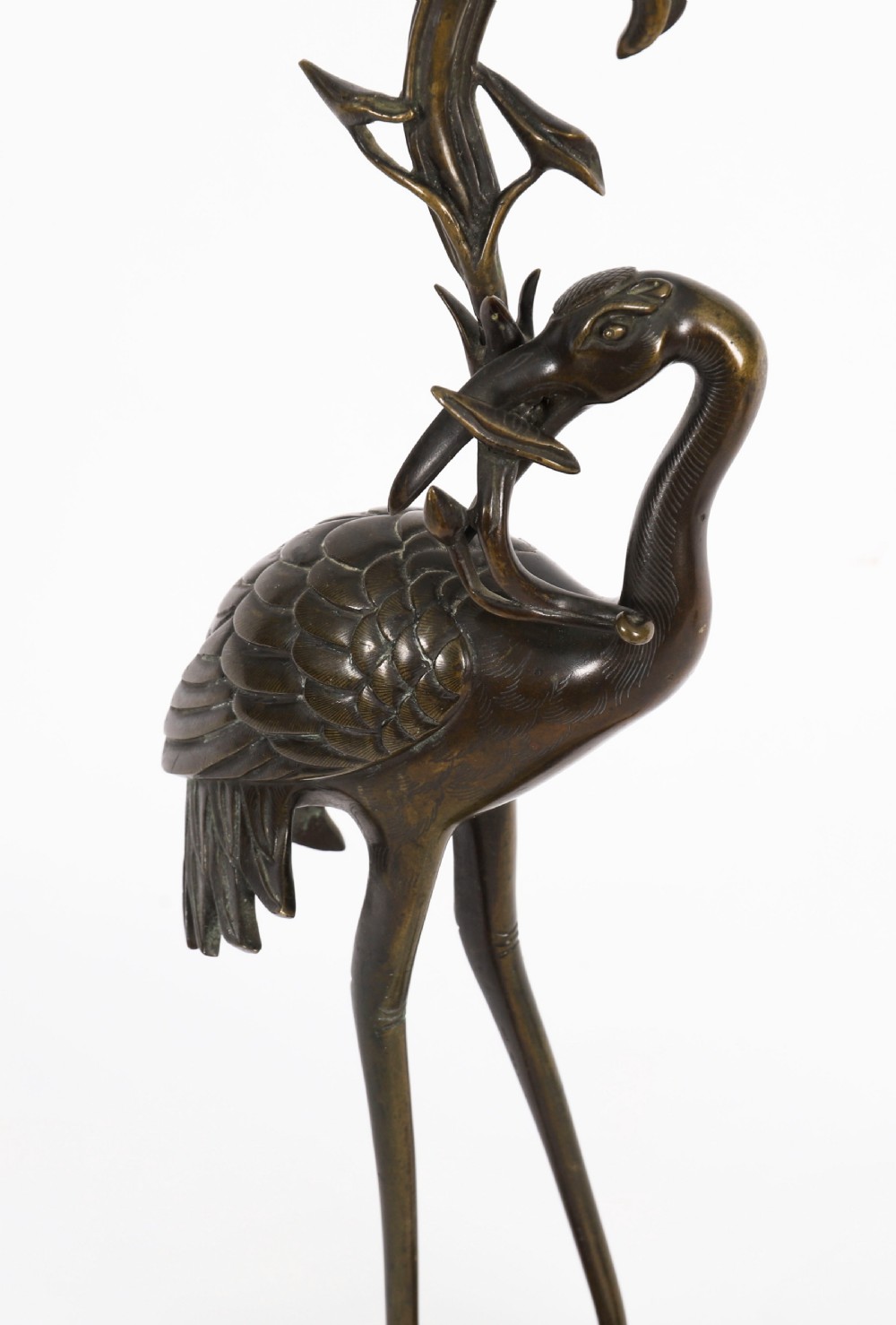 A pair of 19th-century Japanese dark bronze pricket candlesticks formed as cranes standing on tortoises holding lotus stems in their beaks. View VI