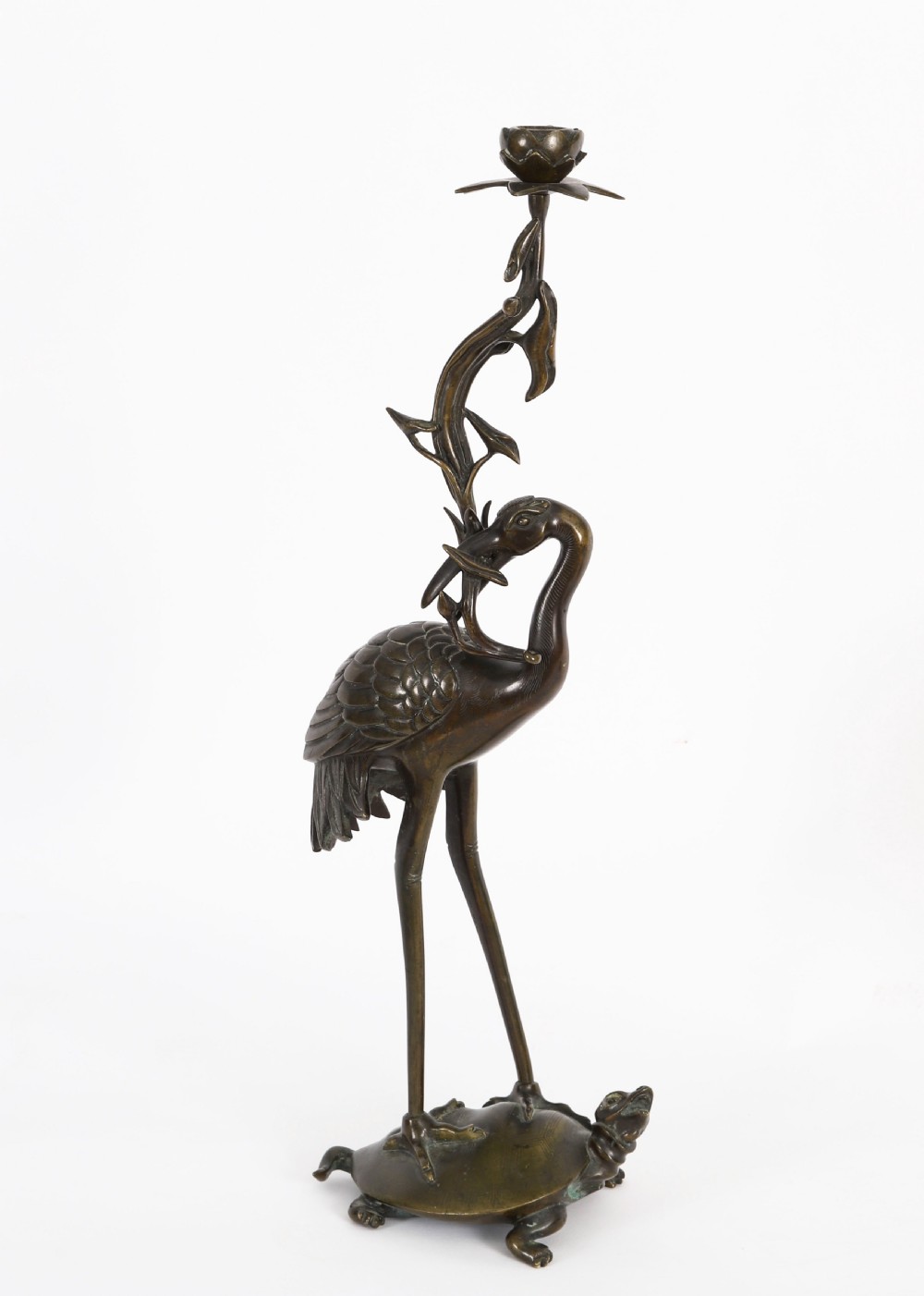 A pair of 19th-century Japanese dark bronze pricket candlesticks formed as cranes standing on tortoises holding lotus stems in their beaks. View VII