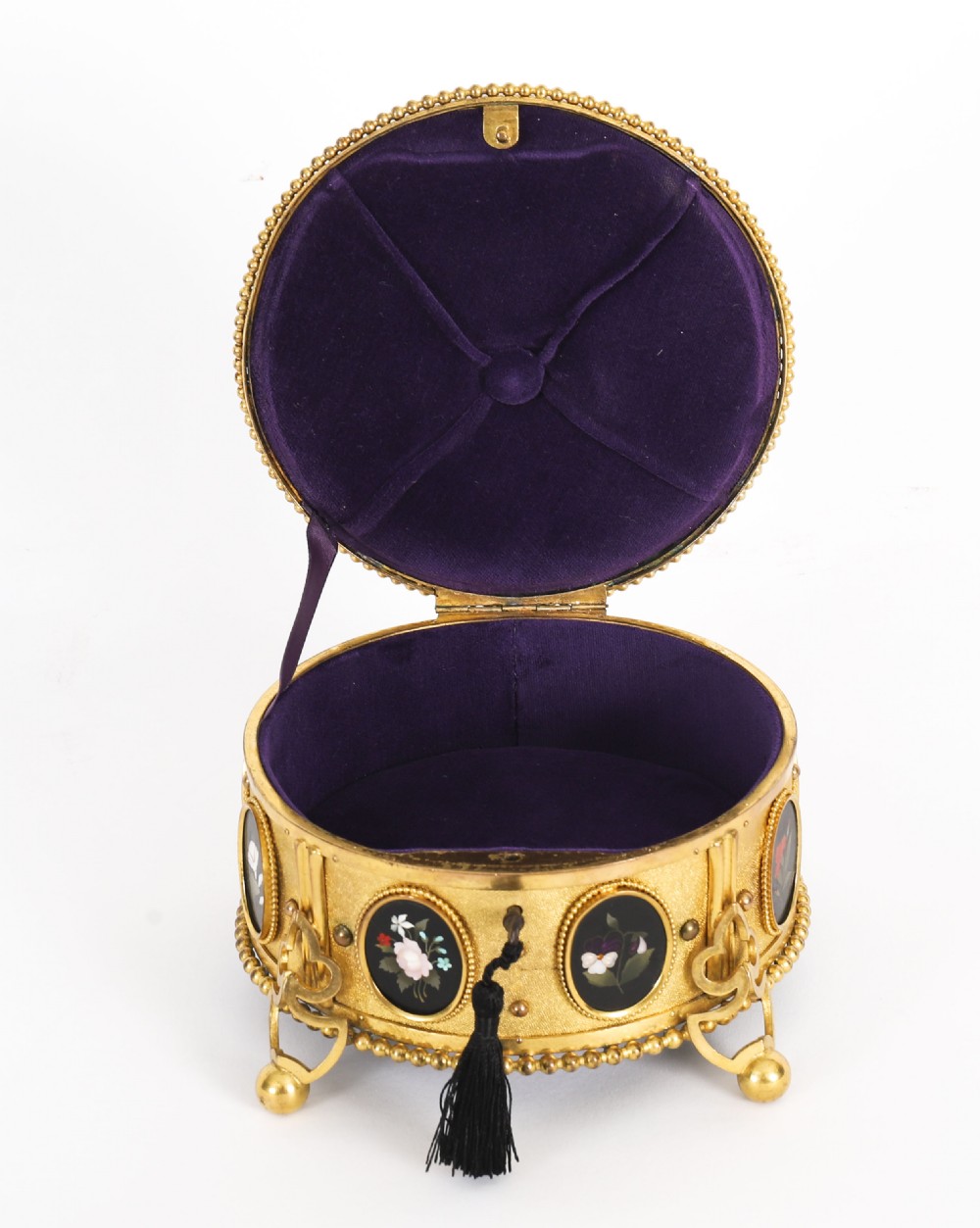 A circular 19th-century ormolu jewellery casket featuring fine Pietra Dura floral and fruit stone inlays set into gilt bronze with a key and tassel. View III