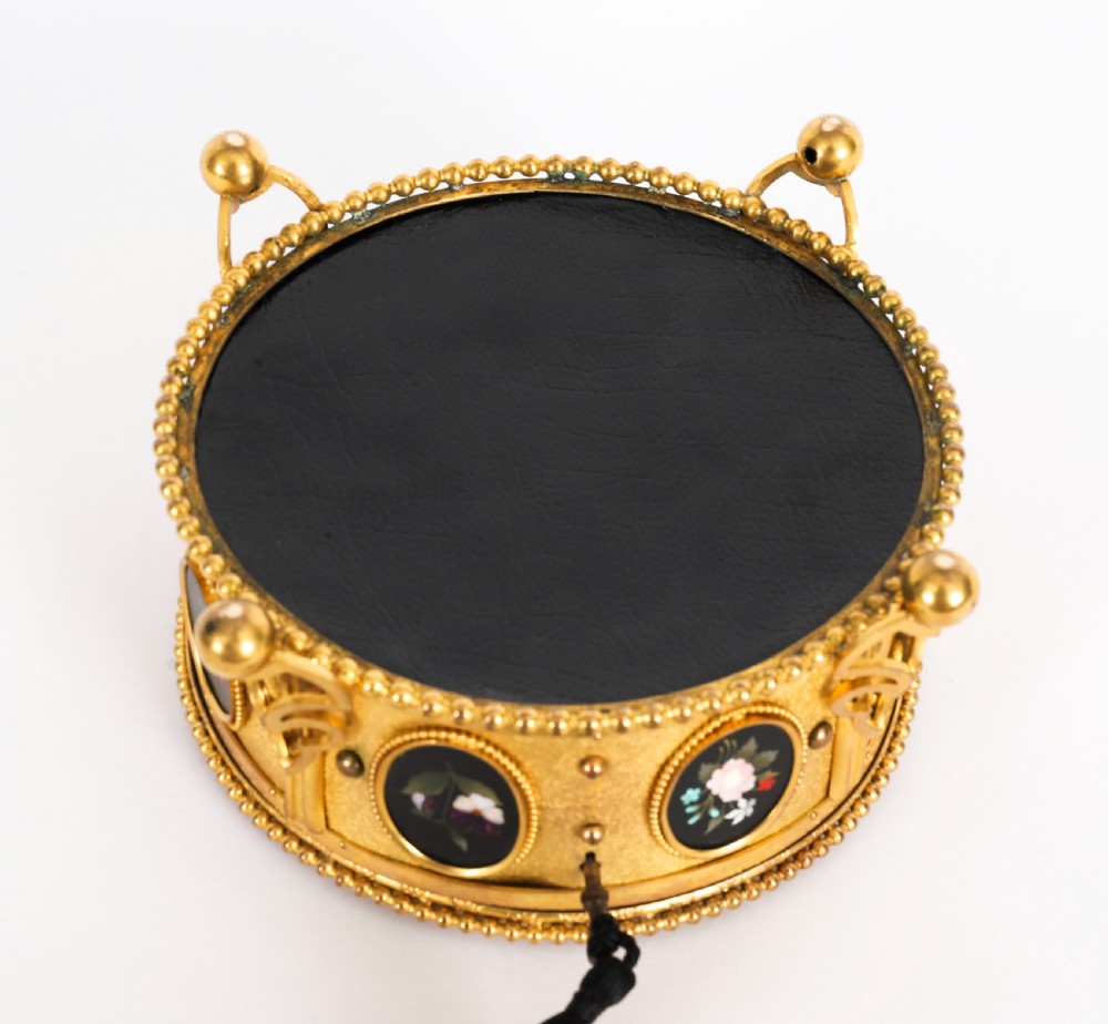 A circular 19th-century ormolu jewellery casket featuring fine Pietra Dura floral and fruit stone inlays set into gilt bronze with a key and tassel. View XI