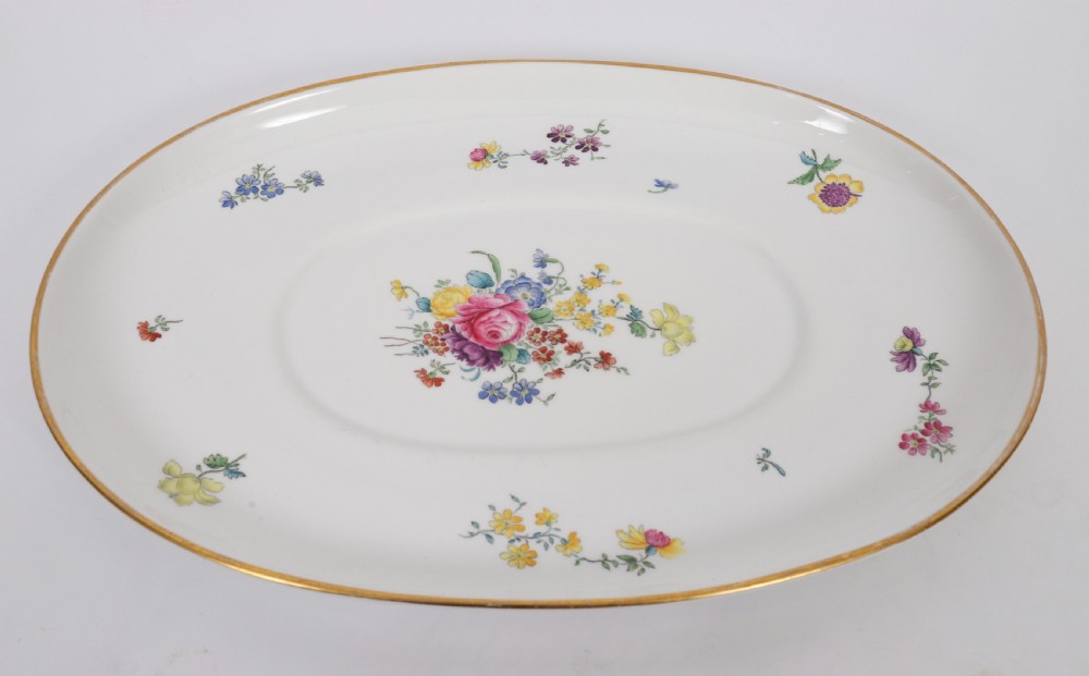 A 60-piece Victorian Copeland Spode white porcelain dinner service decorated with hand-painted floral bouquets, gilt rims, plates, crescent side dishes, and a covered tureen. View III