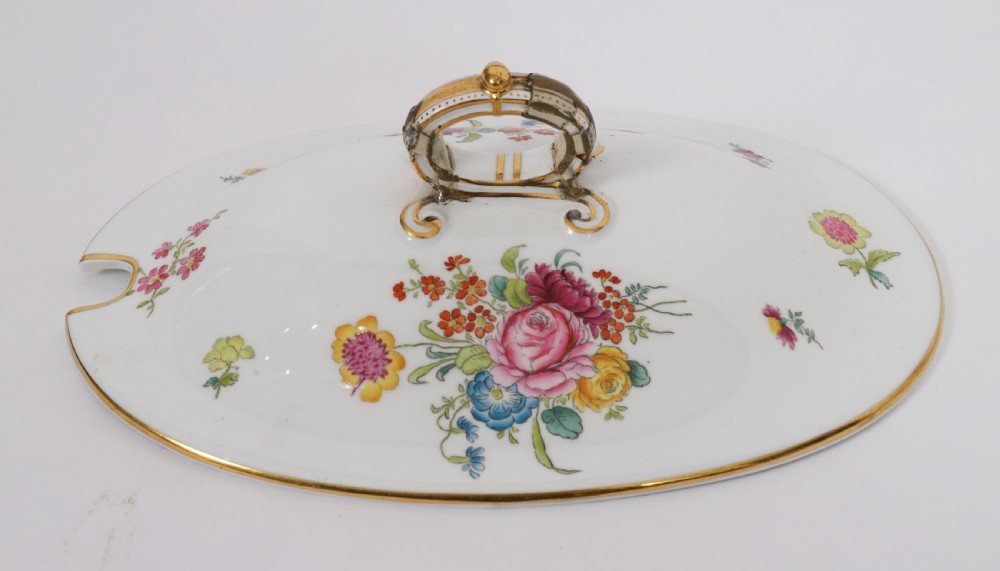 A 60-piece Victorian Copeland Spode white porcelain dinner service decorated with hand-painted floral bouquets, gilt rims, plates, crescent side dishes, and a covered tureen. View V