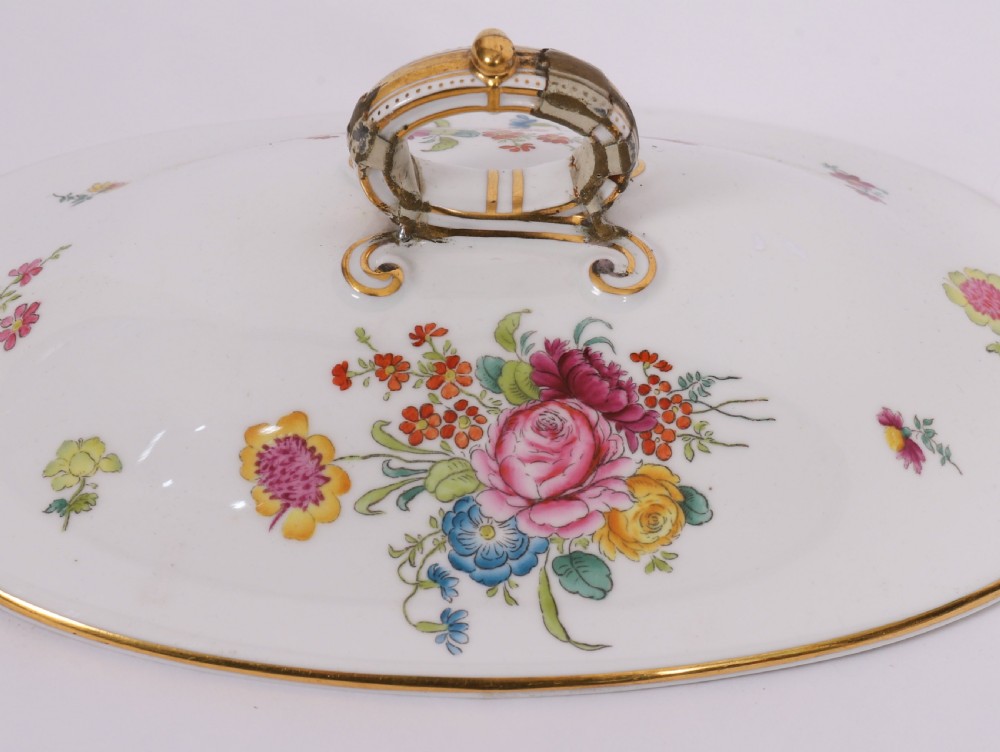 A 60-piece Victorian Copeland Spode white porcelain dinner service decorated with hand-painted floral bouquets, gilt rims, plates, crescent side dishes, and a covered tureen. View VI