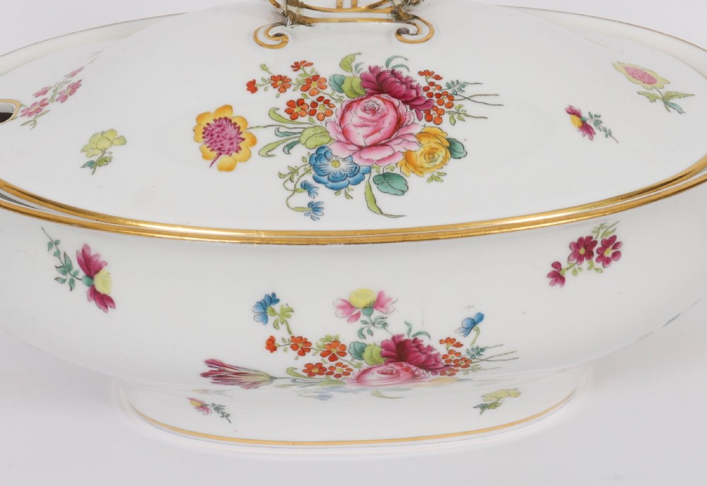 A 60-piece Victorian Copeland Spode white porcelain dinner service decorated with hand-painted floral bouquets, gilt rims, plates, crescent side dishes, and a covered tureen. View VIII