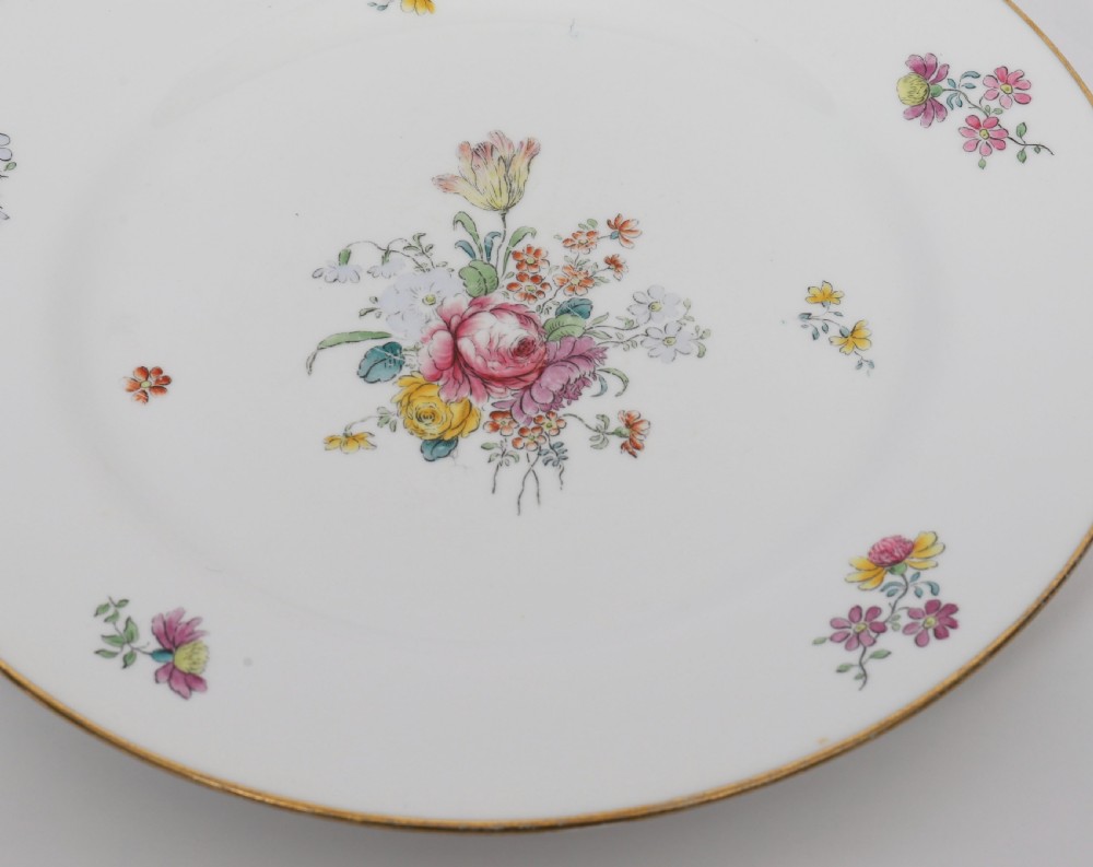 A 60-piece Victorian Copeland Spode white porcelain dinner service decorated with hand-painted floral bouquets, gilt rims, plates, crescent side dishes, and a covered tureen. View XI