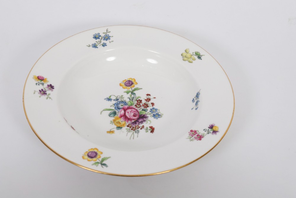 A 60-piece Victorian Copeland Spode white porcelain dinner service decorated with hand-painted floral bouquets, gilt rims, plates, crescent side dishes, and a covered tureen. View XIX