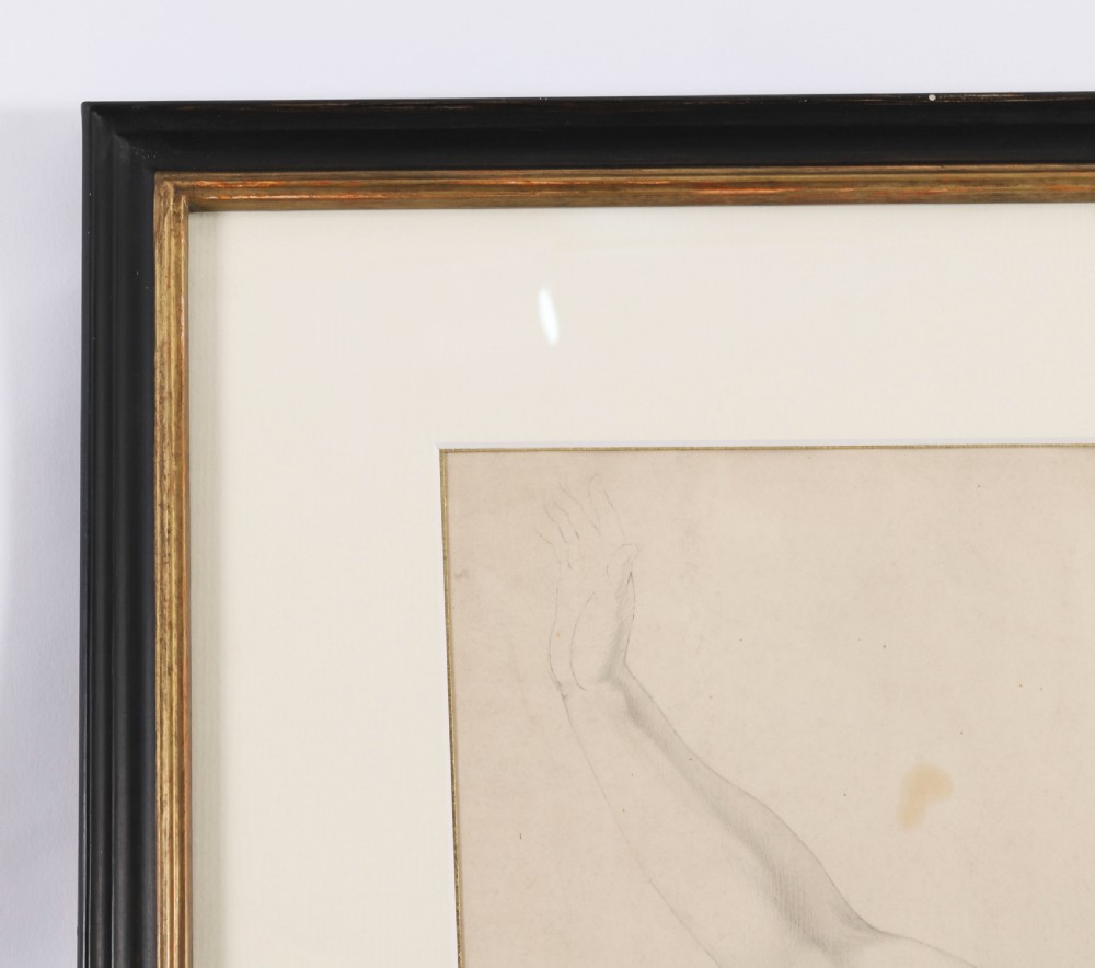 A framed late 19th-century graphite drawing on cream paper depicting a male anatomical figural study with an raised arm, set within a black frame featuring a gold inner trim. View V