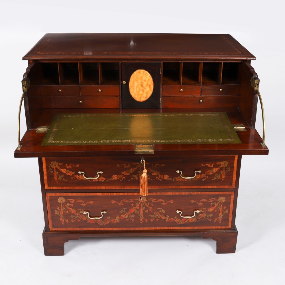 An eighteenth-century dark mahogany secretaire chest featuring intricate floral marquetry inlay on the drawer fronts, brass handles, and bracket feet. View II