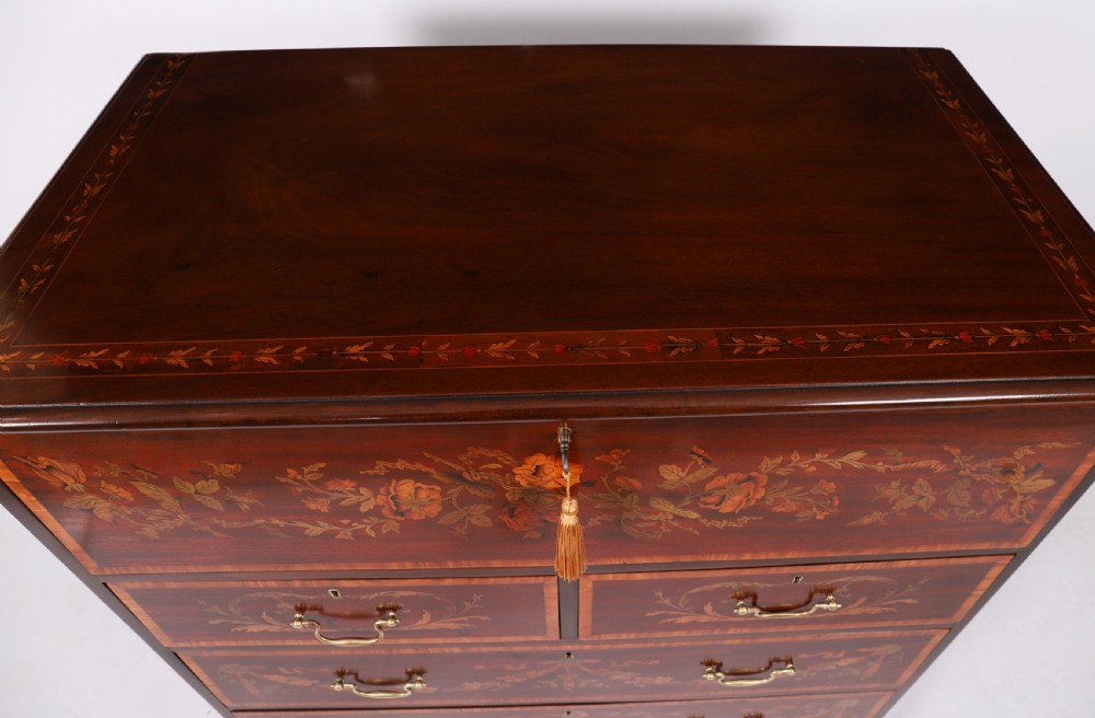 An eighteenth-century dark mahogany secretaire chest featuring intricate floral marquetry inlay on the drawer fronts, brass handles, and bracket feet. View V