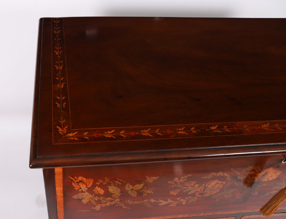 An eighteenth-century dark mahogany secretaire chest featuring intricate floral marquetry inlay on the drawer fronts, brass handles, and bracket feet. View VI