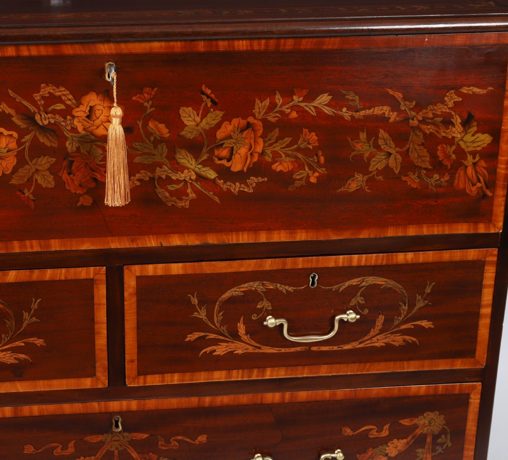 An eighteenth-century dark mahogany secretaire chest featuring intricate floral marquetry inlay on the drawer fronts, brass handles, and bracket feet. View IX
