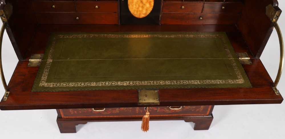 An eighteenth-century dark mahogany secretaire chest featuring intricate floral marquetry inlay on the drawer fronts, brass handles, and bracket feet. View X